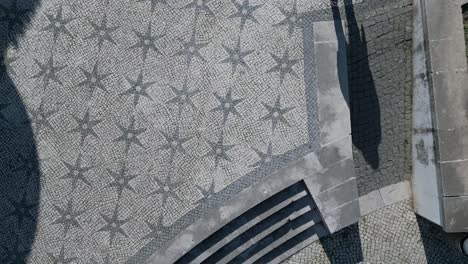 top view shows residential district with historic floors, parked cars, people walking, and casting shadows of beauty