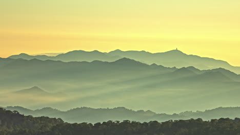 magical sunrise glow over foggy mountain landscape, time lapse view