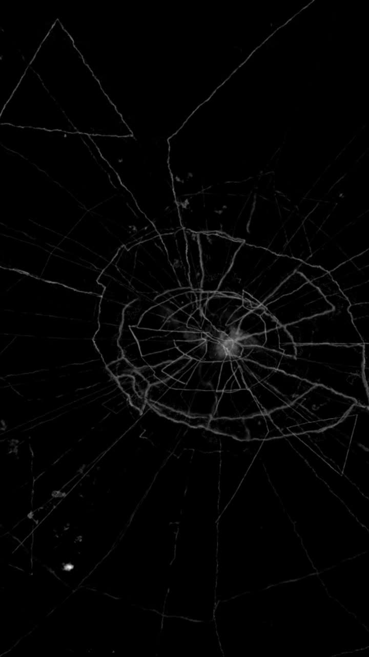 A circular pattern of shattered glass, resembling a bullet hole, on a black background. A vertical overlay for crime, action, or high-impact scenes