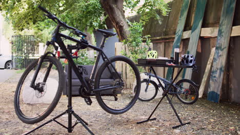 Broken-bicycle-near-toolbox-outside