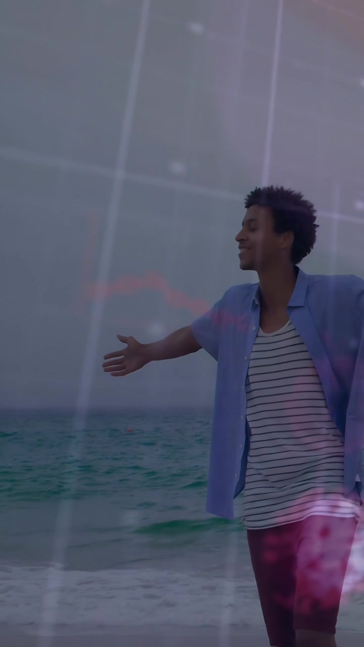 Video verticale: Uomo che cammina e si gira sulla spiaggia, causando l'innalzamento di barre rosa per marketing.