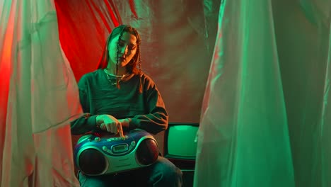young woman with braids and boombox in neon-lit retro setting