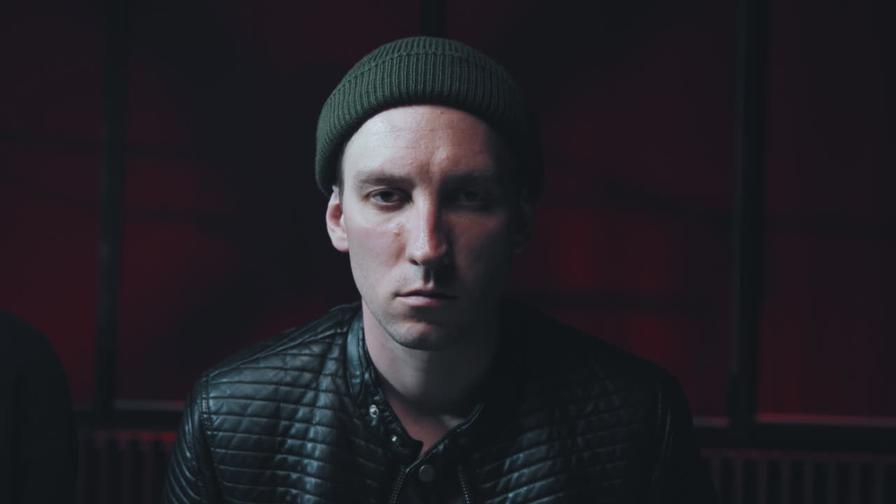 Arrested Young Man Looking at Camera