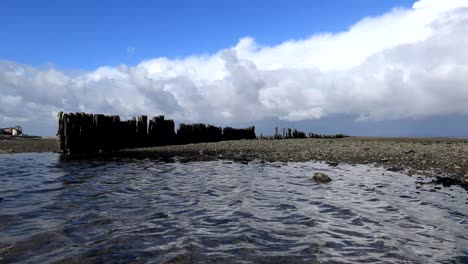 Morecambe-Bay-shingle-pool-with-blue-sky