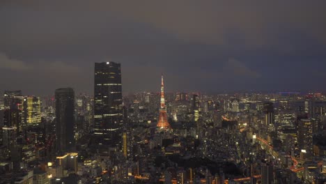 tokyo evening timelapse: mori tower and city lights coming to life