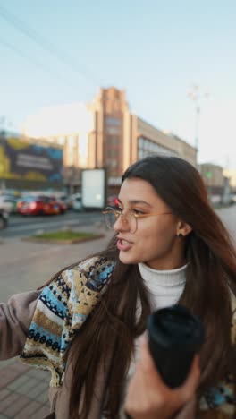 young woman taking selfie outdoors