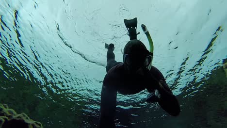 free diver in silfra iceland cold water selfie