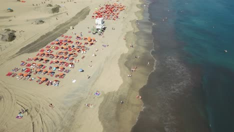 4k aerial view on the "el veril" beach in the south of gran canaria in spain, canary islands.