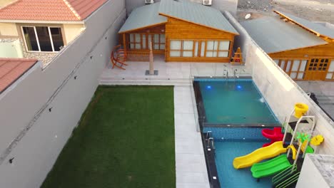 landscape of newly built house with pool and garden