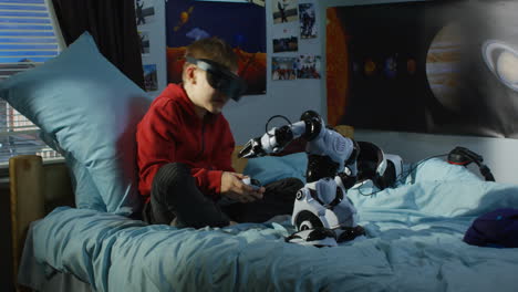 boy playing with vr headset and robot toy in bedroom