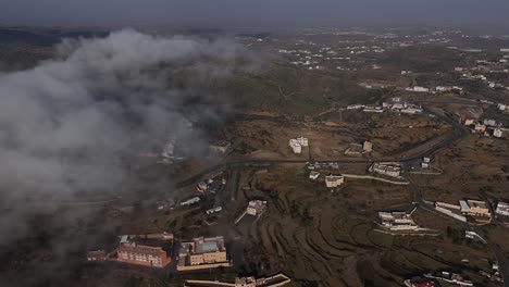 Aerial-approaching-car-stopped-near-road,-Abha,-Saudi-Arabia