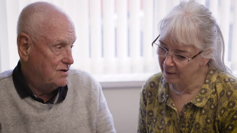 elderly couple in conversation