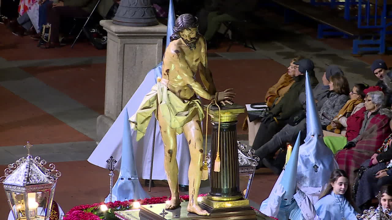 Religious Procession Featuring a Statue of Jesus