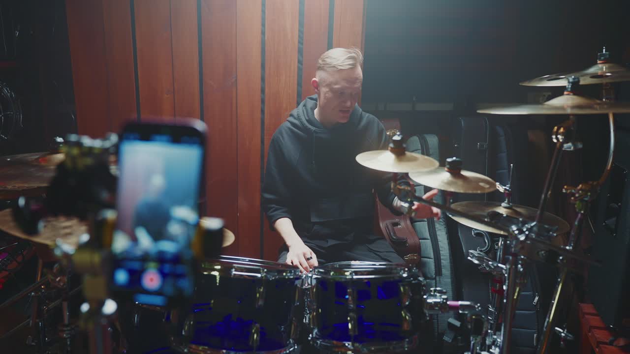 Drummer teaching a lesson via online streaming.