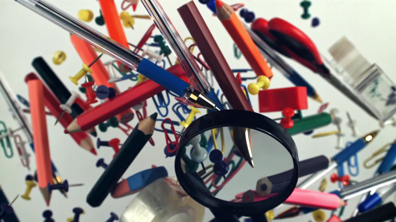 Colorful Office and School Supplies Floating on White Background