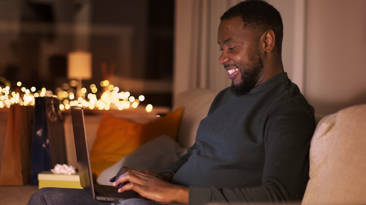 Man shopping online at night