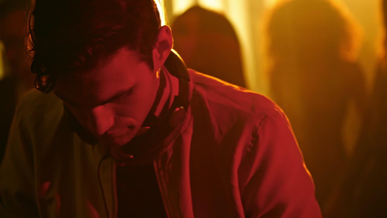 Man Working as DJ at Party