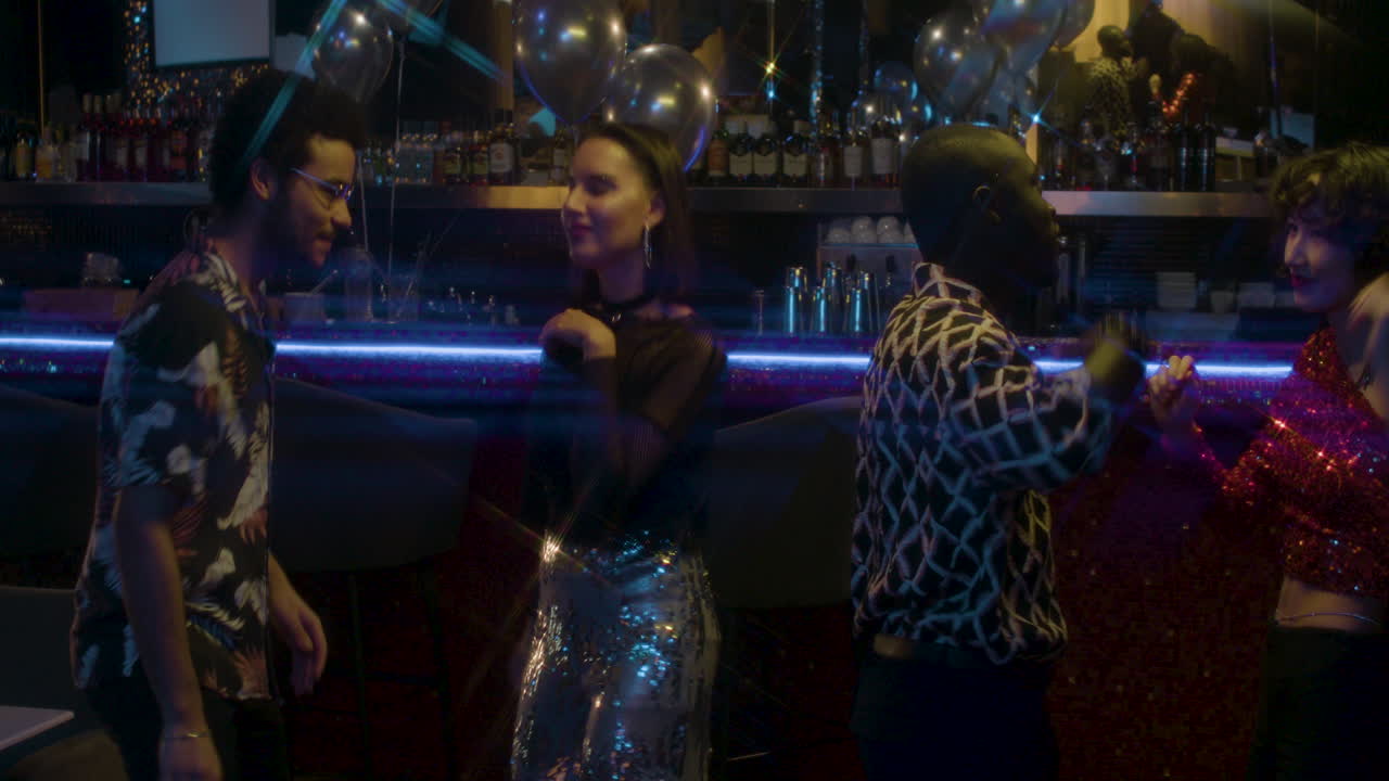 Friends dancing in a party