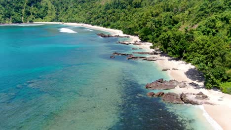 Vacation-paradise,-tropical-beach-with-rocks-and-white-sand,-Wediombo,-Indonesia