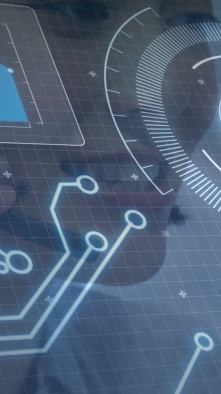 Vertical video: Woman leaning closer, face centering on glass HUD gauge to inspect tech data
