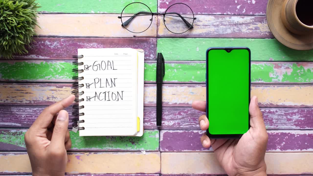 Goal, Plan, Action Notebook and Smartphone