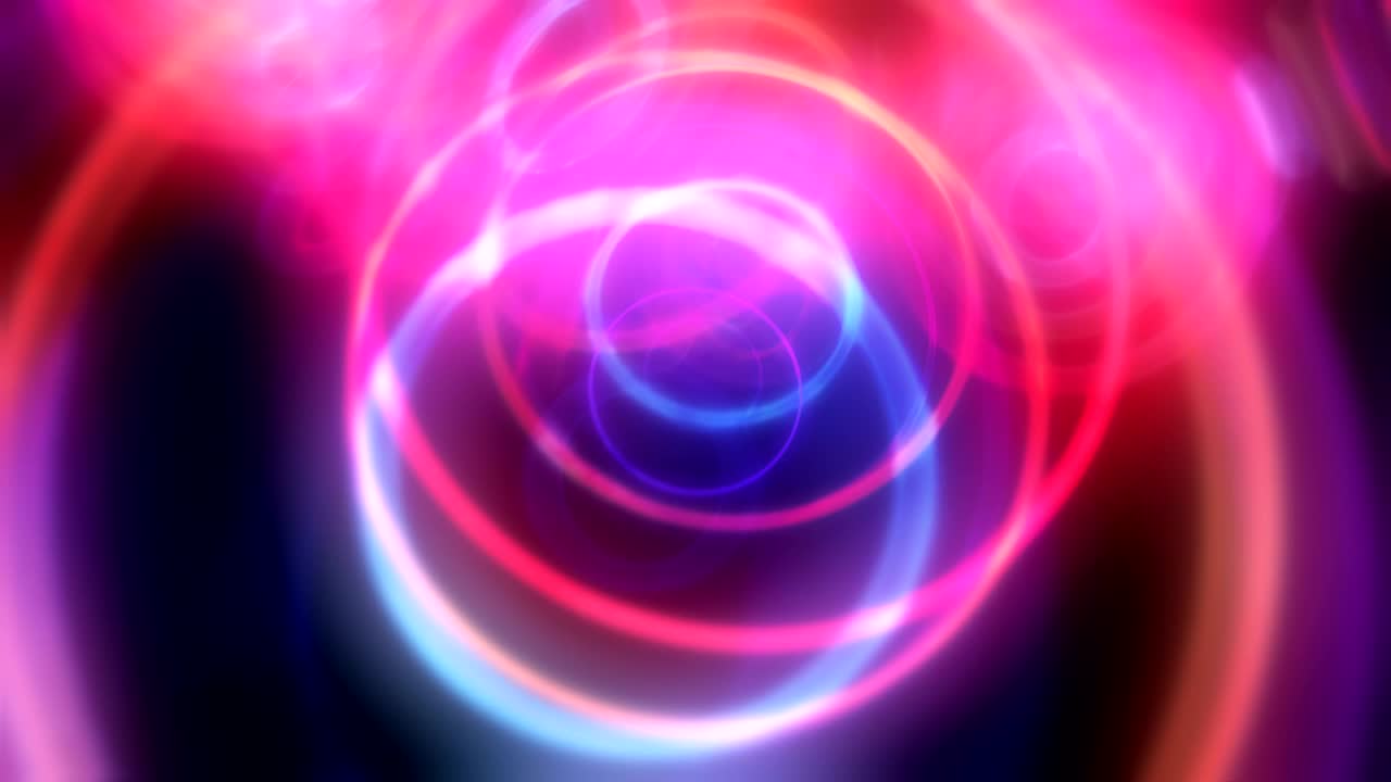 un tunnel di cerchi al neon, un toroide colorato come un volo verso l'altro mondo.