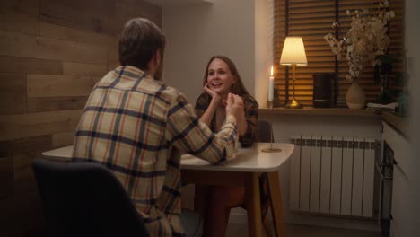 couple enjoying a romantic dinner at home