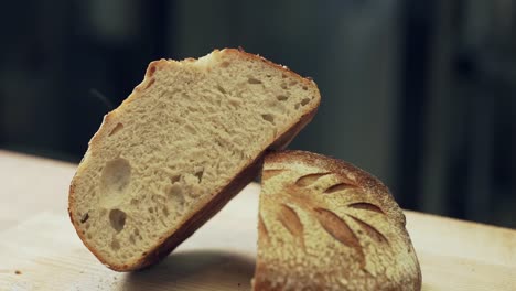 fresh rye bread lies on a wooden board and steams