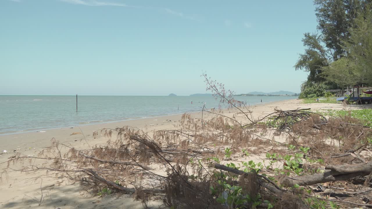 Lok Kawi Beach The Beach Sits Near Residentail Zone,With Its Shoreline Sea,Beds,Good For Casual Beach Time,During Sunset,With White Sandy Beach,Blue Sea Facing Few Island To The South China Sea
