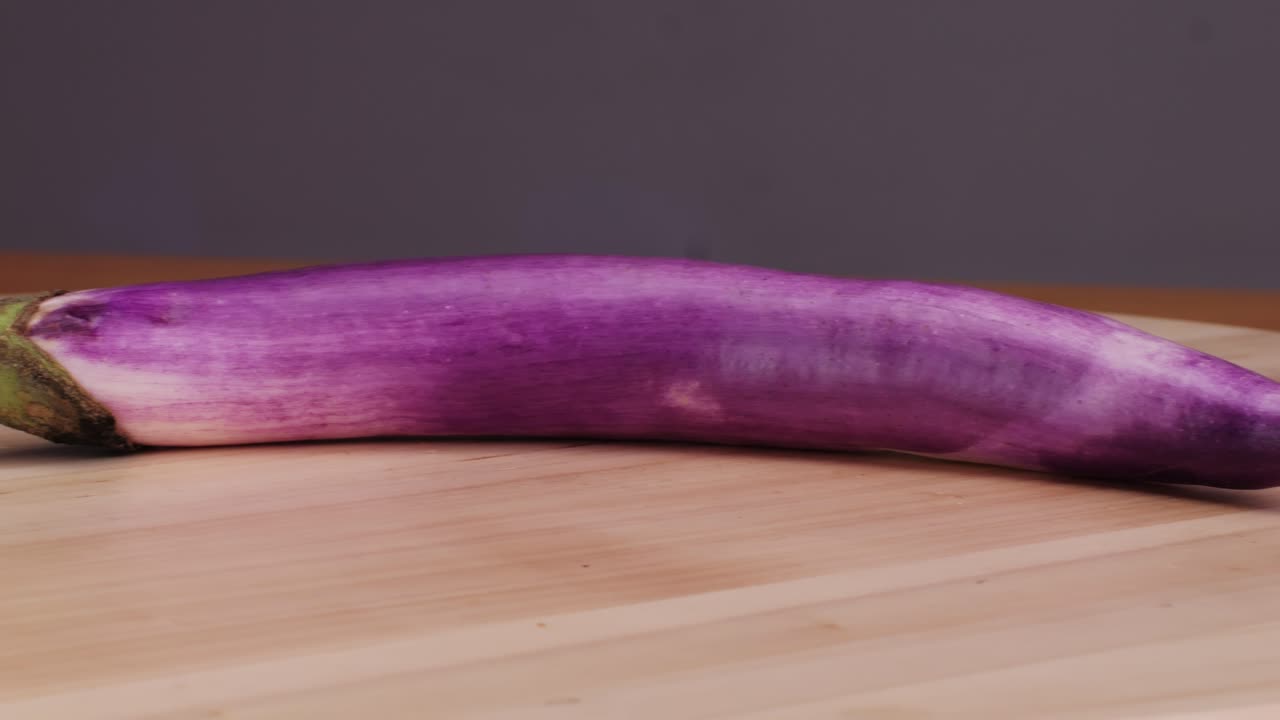 Purple Eggplant on Cutting Board