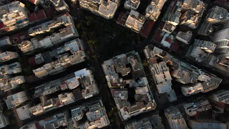 Aerial-view-of-Exarcheia-Square,-Athens,-while-taxi-passes-by