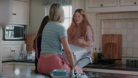 group-of-teenage-girls-eating-pizza-in-kitchen-having-fun-chatting-together-using-smartphones-sharing-lifestyle-friends-hanging-out-enjoying-relaxing-at-home