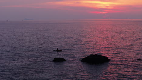 fisherman at sunset on the ocean