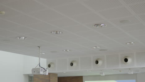 White-ceiling-with-installed-lamps,-air-inlets---ventilation