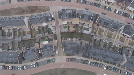 Top-down-aerial-of-modern-suburban-houses-with-solar-panels-on-rooftop