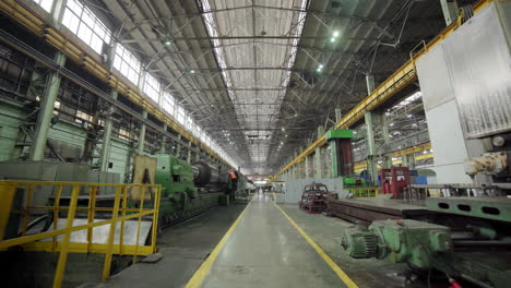 large industrial factory interior with machinery and workers