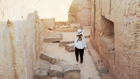 woman exploring ancient ruins