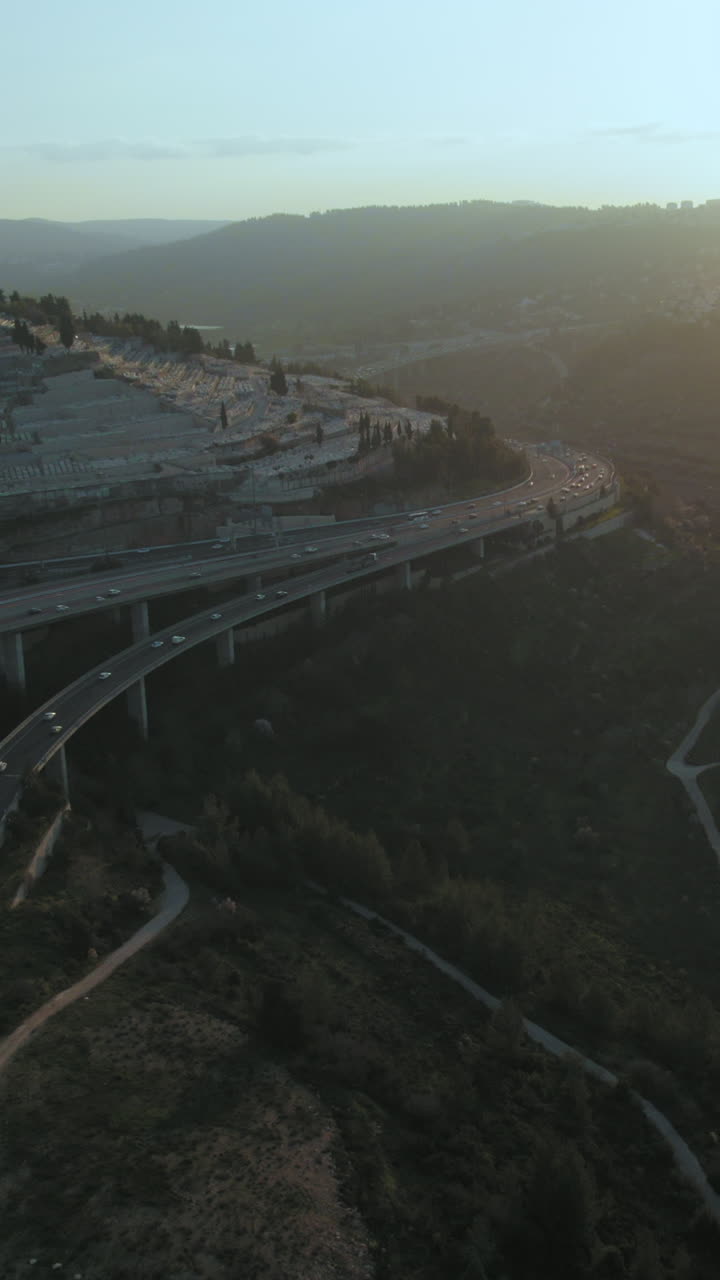 Har HaMenuchot cemetery, at the entrance to Jerusalem, Israel. Adjacent to the cemetery are many traffic interchanges for visitors coming and going from Jerusalem - vertical video