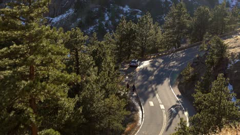 aerial view of car driving in the mountains