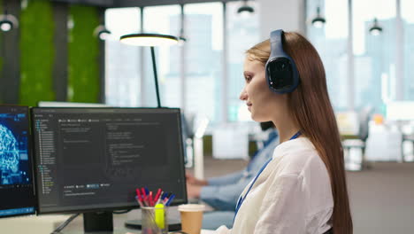 junior dev developing ai software applications, optimizing code, listening music