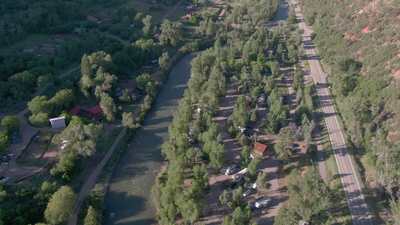 Aerial view pans up from the river to reveal Mount Sopris in Carbondale Colorado