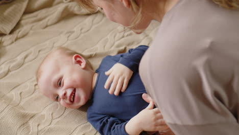 loving mother bonding with cute baby