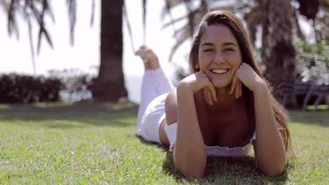 excited woman practicing yoga on shoreline