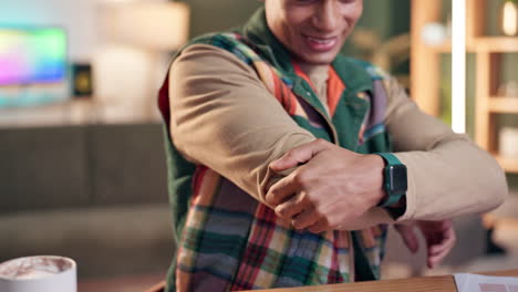 a man is holding his elbow