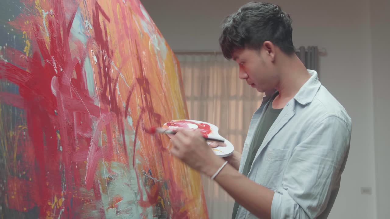 Artist Working On Abstract Painting