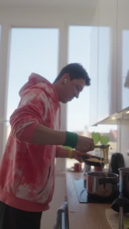 young person cooking ramen
