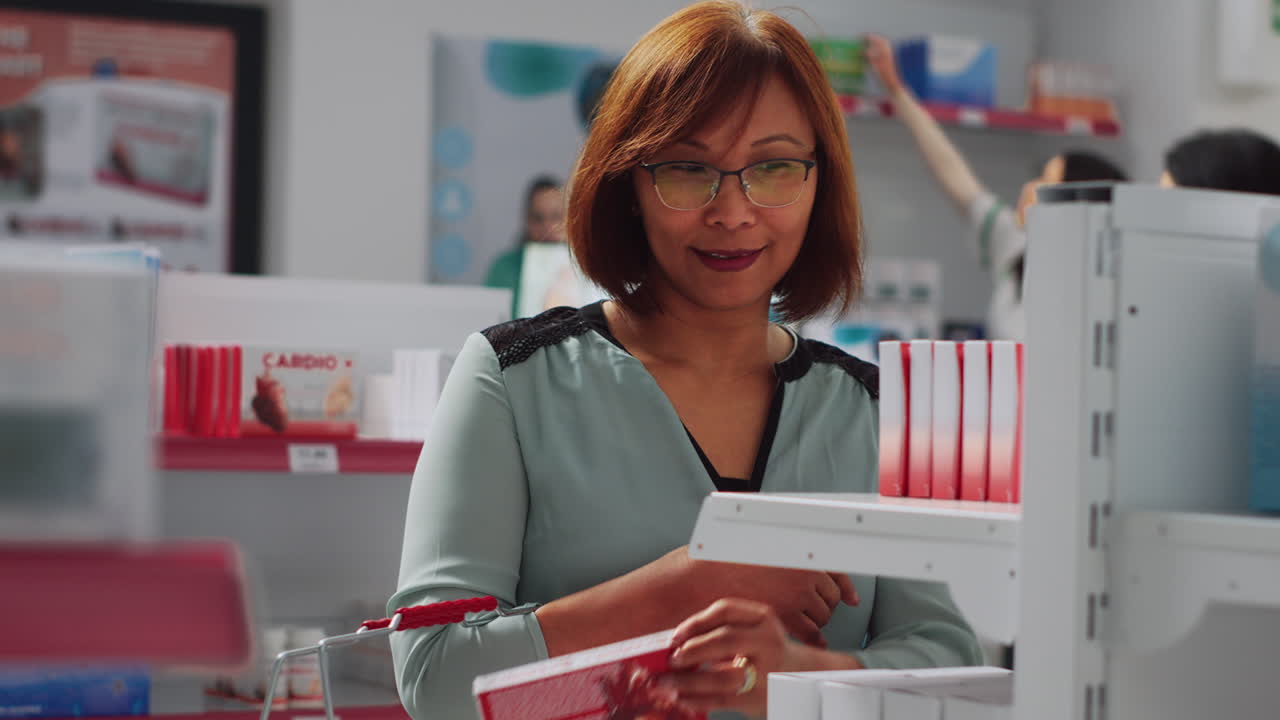Woman shopping for medicine in pharmacy