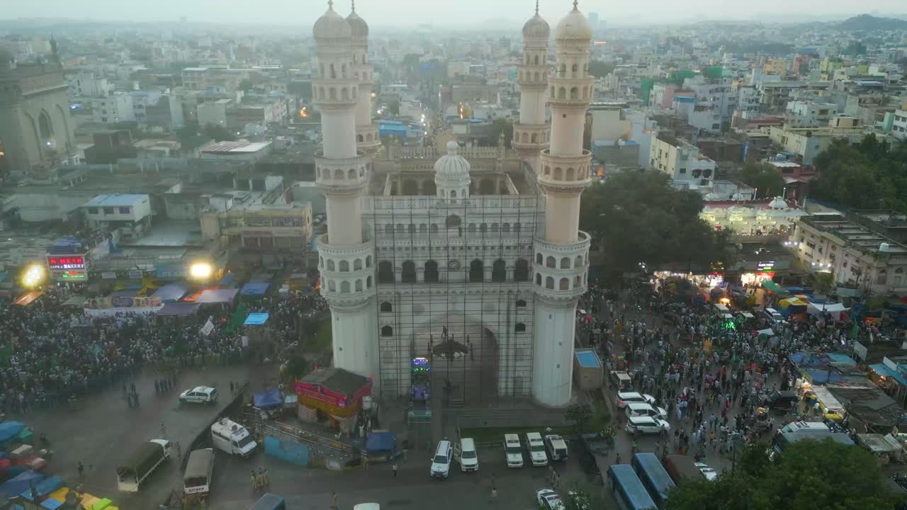 Aerial View of Charminar in Hyderabad at Night with a Large Crowd