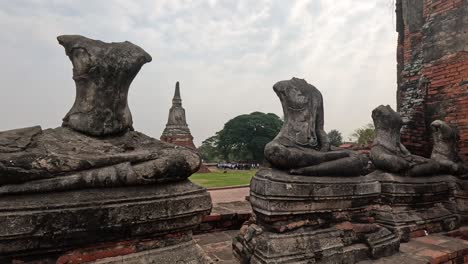 decapitated buddha statues at a historic site