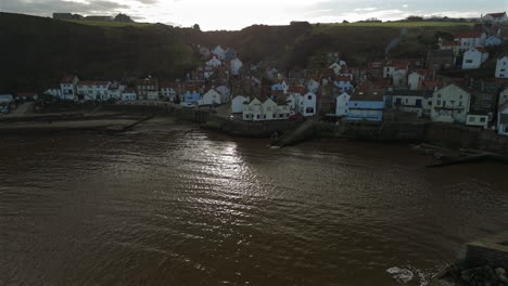 establishing drone shot of staithes on sunny day north yorkshire uk